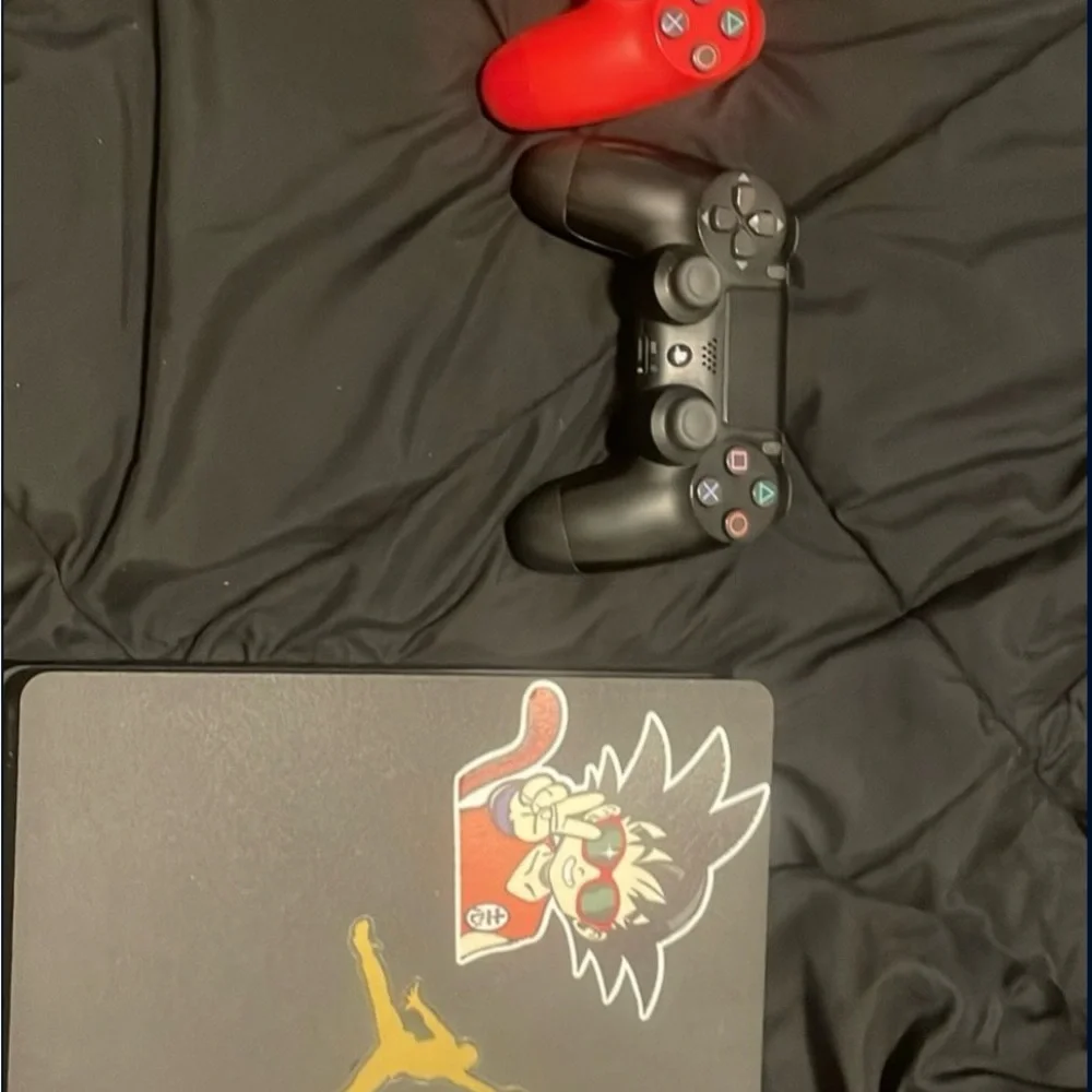 Black and Red Gaming Console with Controllers With Wired Headset